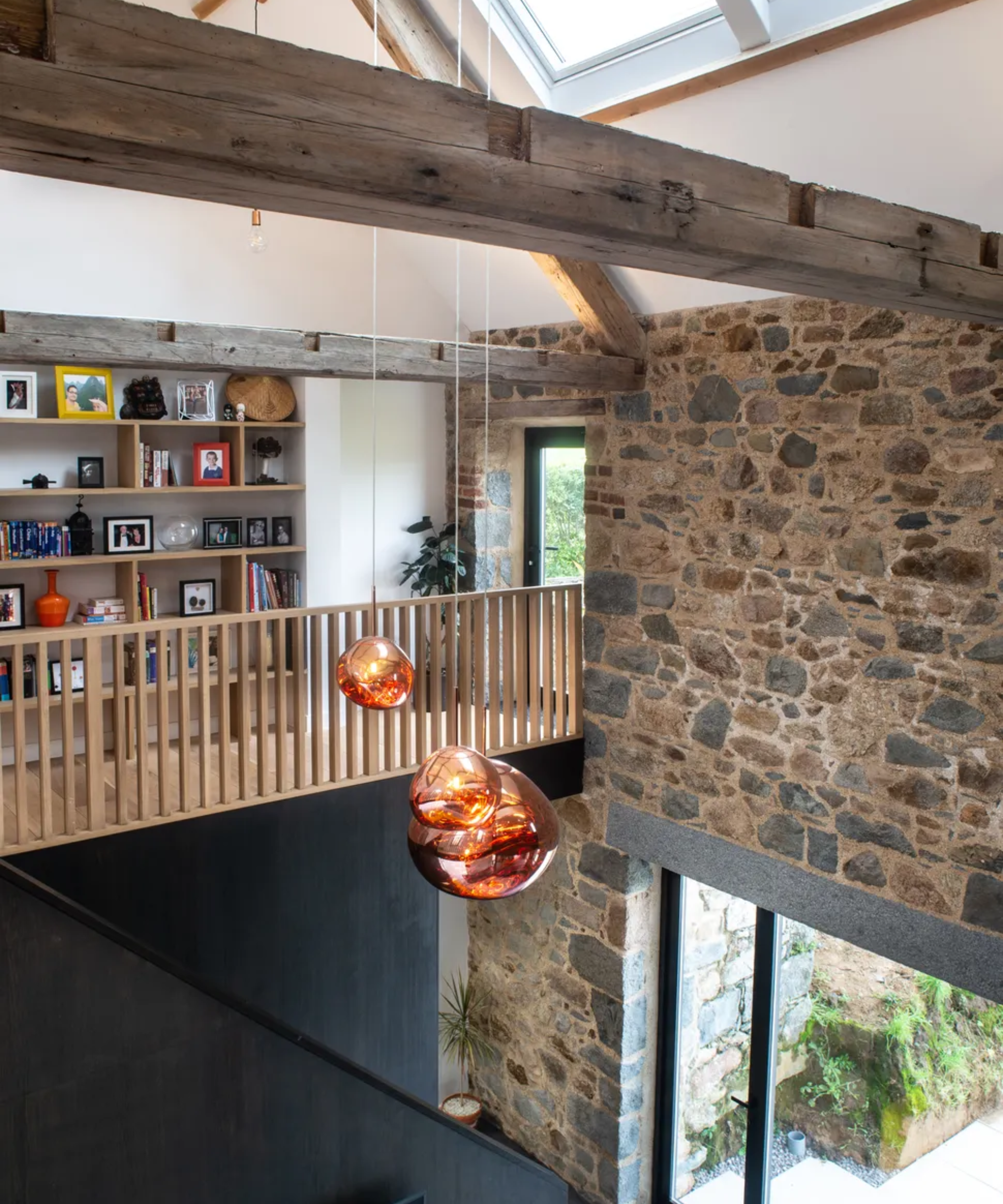 barn conversion with statement pendant lighting and mezzanine area