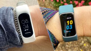 a photo of the Garmin Vivosmart 5 and the Fitbit Charge 5