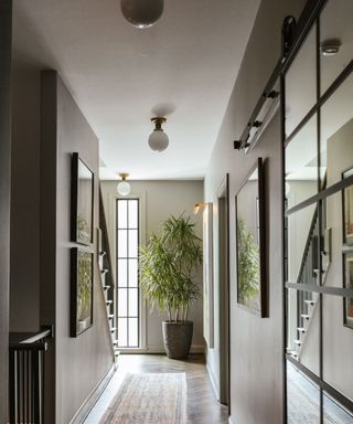 hallway with neutral walls, white ceiling and modern furnishings