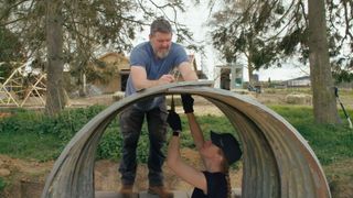 Lucy and Mike assemble an underground planter using an old WW2 shelter.
