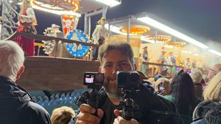 Adam Juniper holding Ace Pro 2 and Osmo Action 5 Pro at Bridgwater Carnival