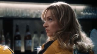 The Bride at the bar in her yellow outfit in Kill Bill Vol. 1
