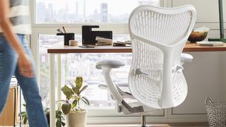 One of the best Herman Miller chairs in front of a crowded desk