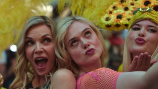 Michelle Pfieffer and Elle Fanning posing with dancers in Las Vegas in Margo's Got Money Troubles Season 1, episode 5 