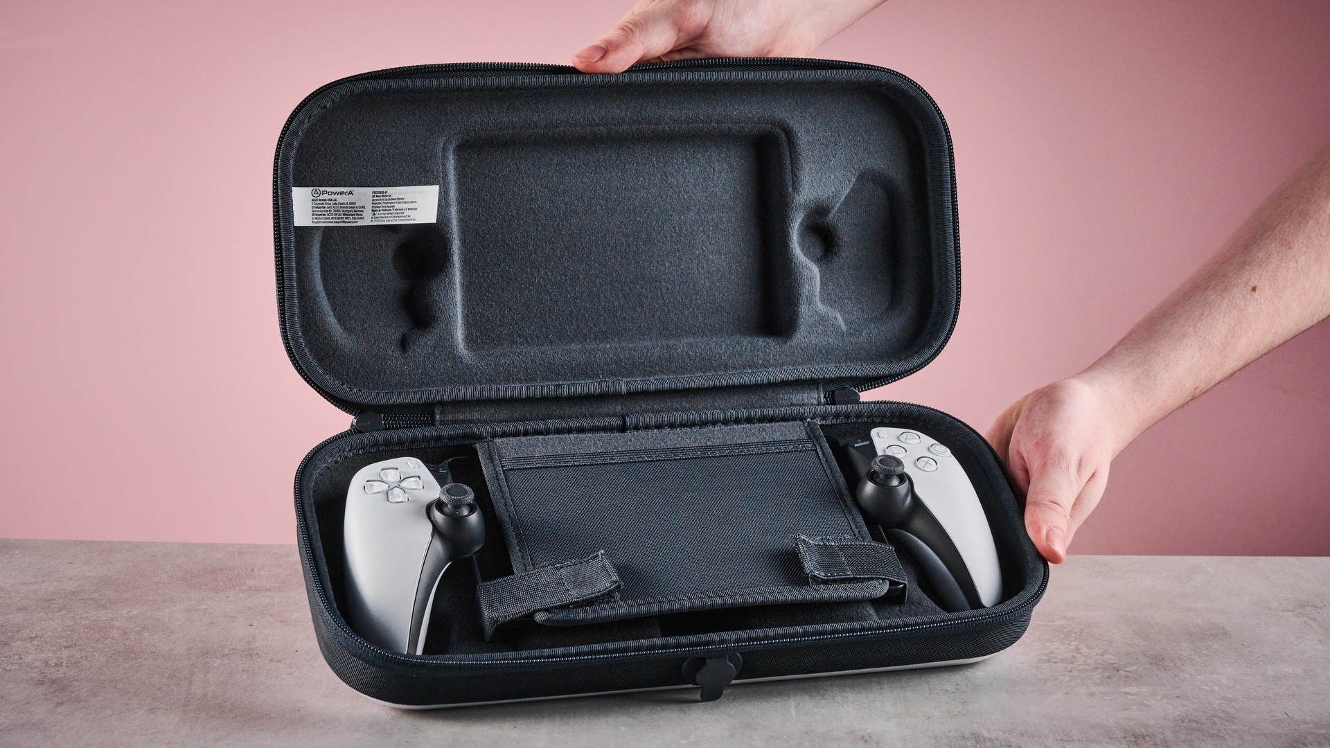 Man holding the PowerA Protection Case for PS Portal open