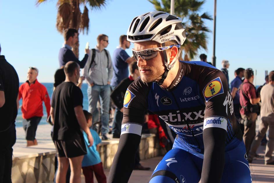 The Etixx-QuickStep jersey is black and blue
