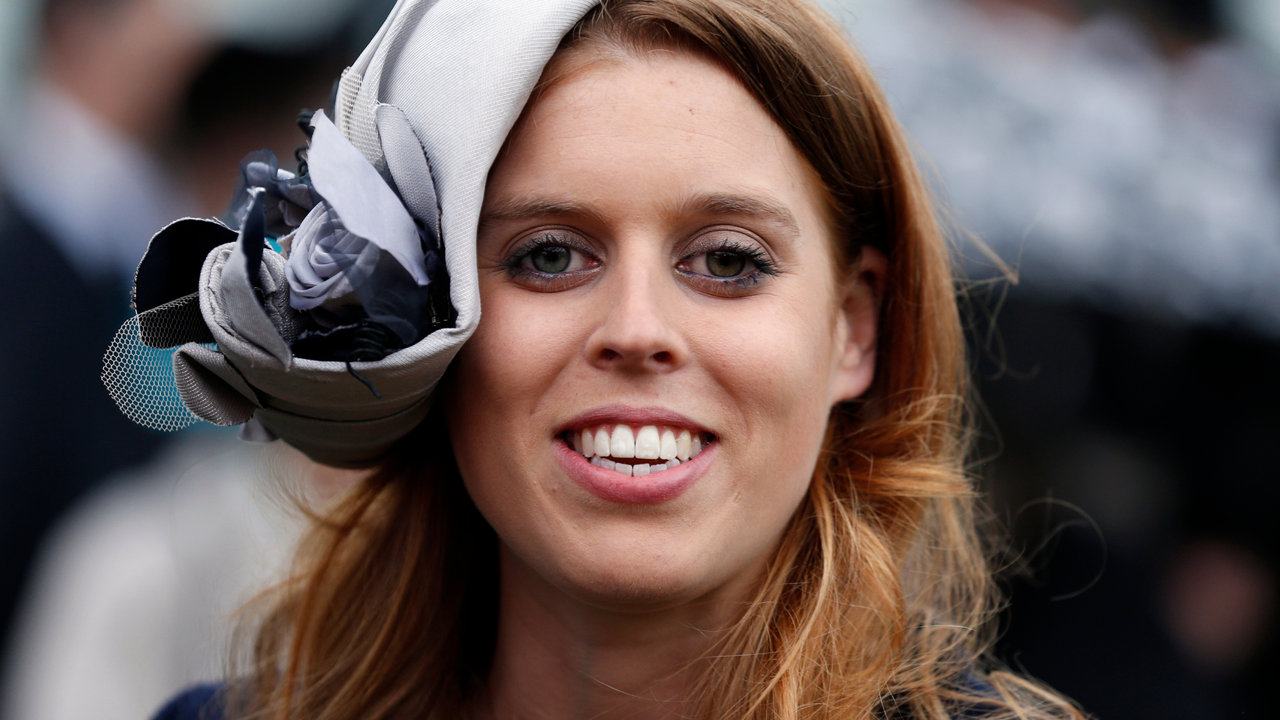 Princess Beatrice smiles during a garden party held at Buckingham Palace, on May 30, 2013 in London, England