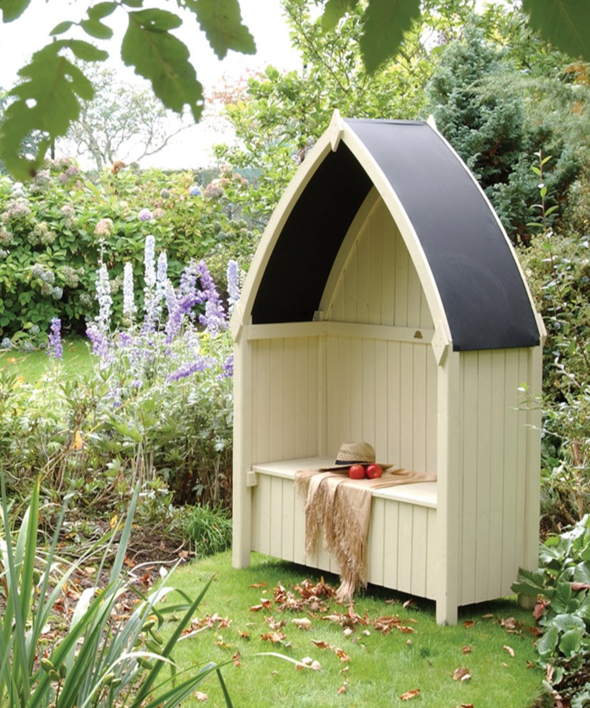 A wooden arbour in a garden