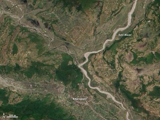 Two weeks after a landslide caused a flash flood in the Seti River in Nepal, the river was wider and siltier than before.