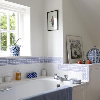 bathroom with bathtub and photo frame
