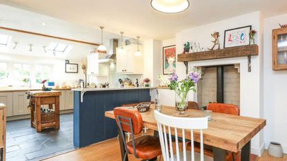 open plan kitchen diner with navy blue breakfast bar