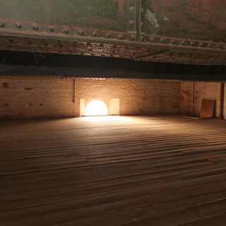 attic water tower tank and white brick wall