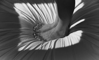 Feet on bed in Vincent Ferrané Embedded book
