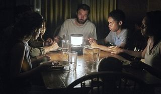 It Comes At Night the family eating by lantern light