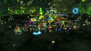 The Wiping As Intended guild celebrates next to the corpse of Archimonde.