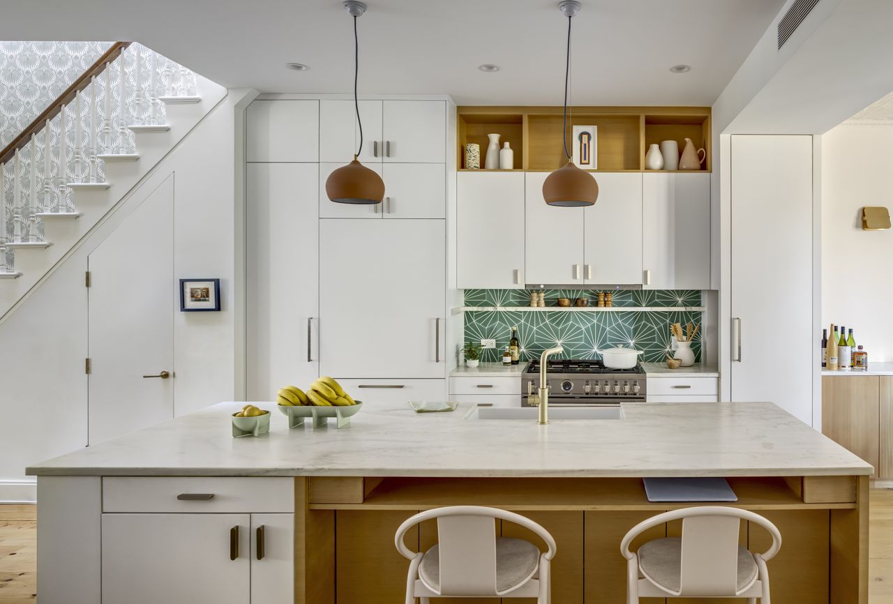 white kitchen with white flush cupboards and island