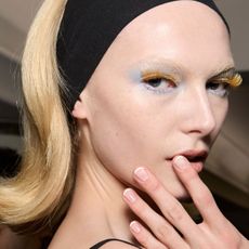 alex consani with a french manicure