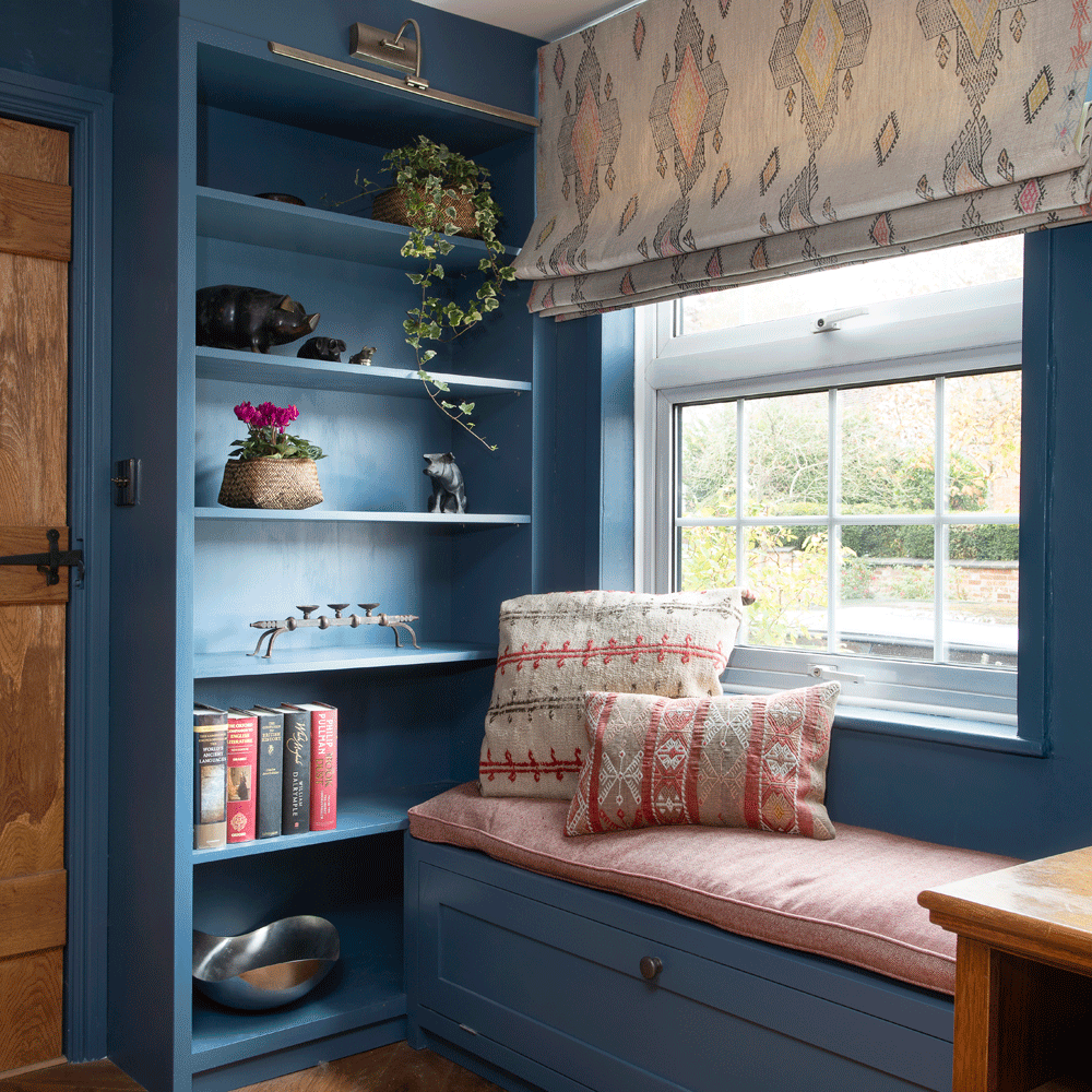window seat with cushions and open shelf