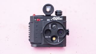 Alfie Tych camera on pink surface