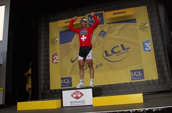 Fabian Cancellara, in his Swiss national road champion jersey, celebrates his stage win on the podium.