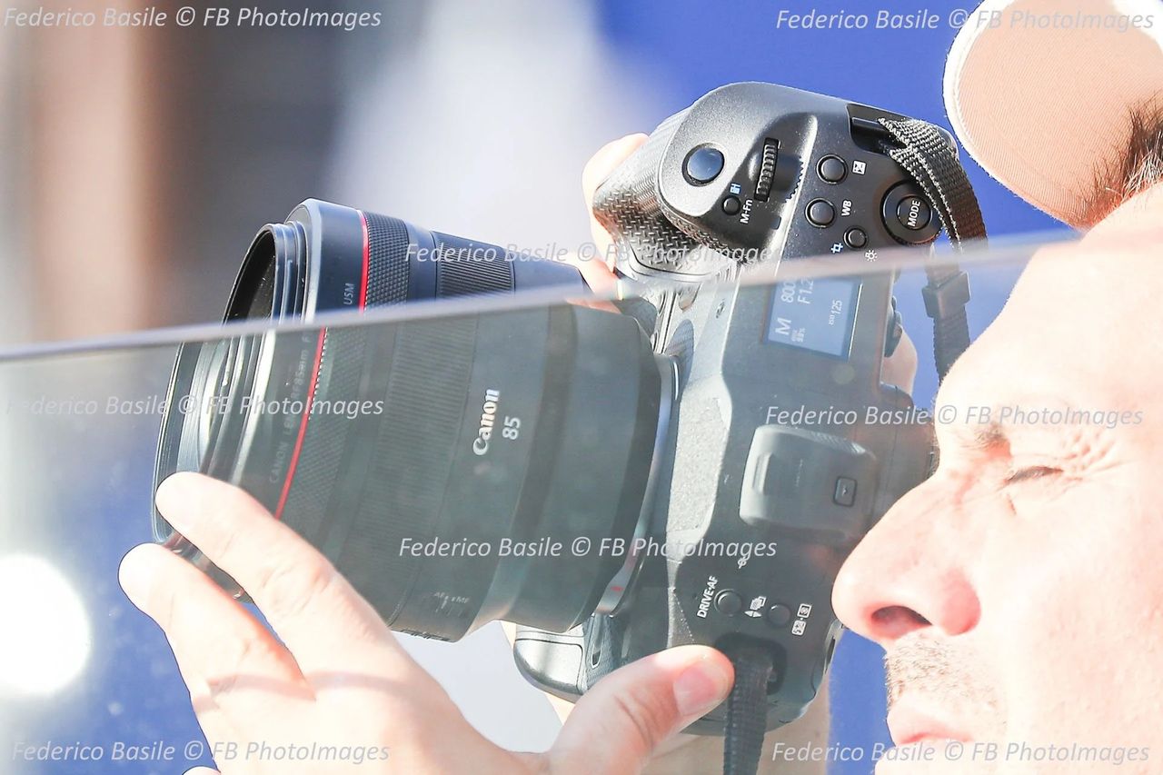 Canon EOS R1 in the hands of a photographer