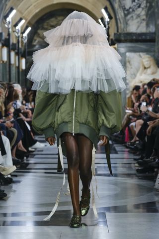 Model on the runway at London Fashion Week S/S 2023 wearing Simone Rocha