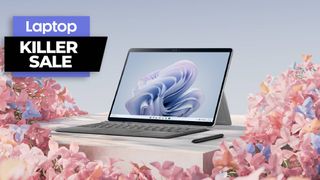 Microsoft Surface Pro 9 tablet with keyboard surrounded by flowers 
