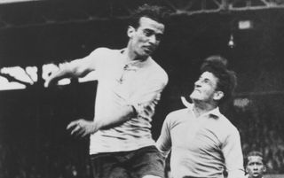 Argentine footballer Enrique Gainzarain (1904-1972) leaps for the ball under pressure from Uruguayan footballer Jose Nasazzi (1901-1968)