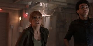 Bryce Dallas Howard and Justice Smith staring down something dangerous in Jurassic World Fallen Kingdom.