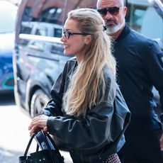 Bella Hadid wearing a black bomber jacket