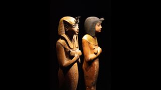 Additional shabtis found in Tutankhamun's tomb. One of them has a headdress known as a "Nemes Headdress," and the other has a wig known as a Nubian wig.