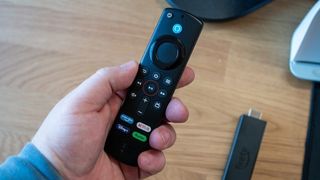 Press the Play/Pause button on the Fire TV Remote