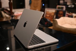 MacBook Pro 14-inch (M3, 2023) angled on a countertop showing lid