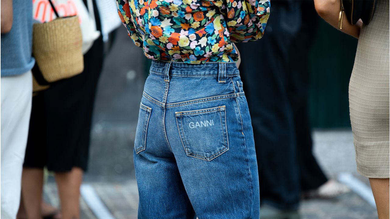 COPENHAGEN, DENMARK - AUGUST 10: Guest outside Ganni wearing Ganni jeans during Copenhagen fashion week SS21 on August 10, 2020 in Copenhagen, Denmark. (Photo by Raimonda Kulikauskiene/Getty Images)