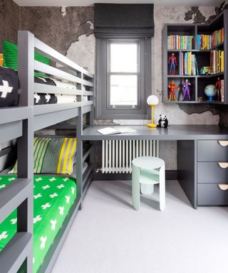 Child's bedroom with gray furniture and green bedding