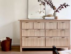 An IKEA hemnes dresser with a textured wood finish 