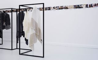 Articles of clothing hanging on a metal hanger