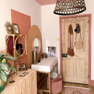 dressing room with wooden flooring and wooden door