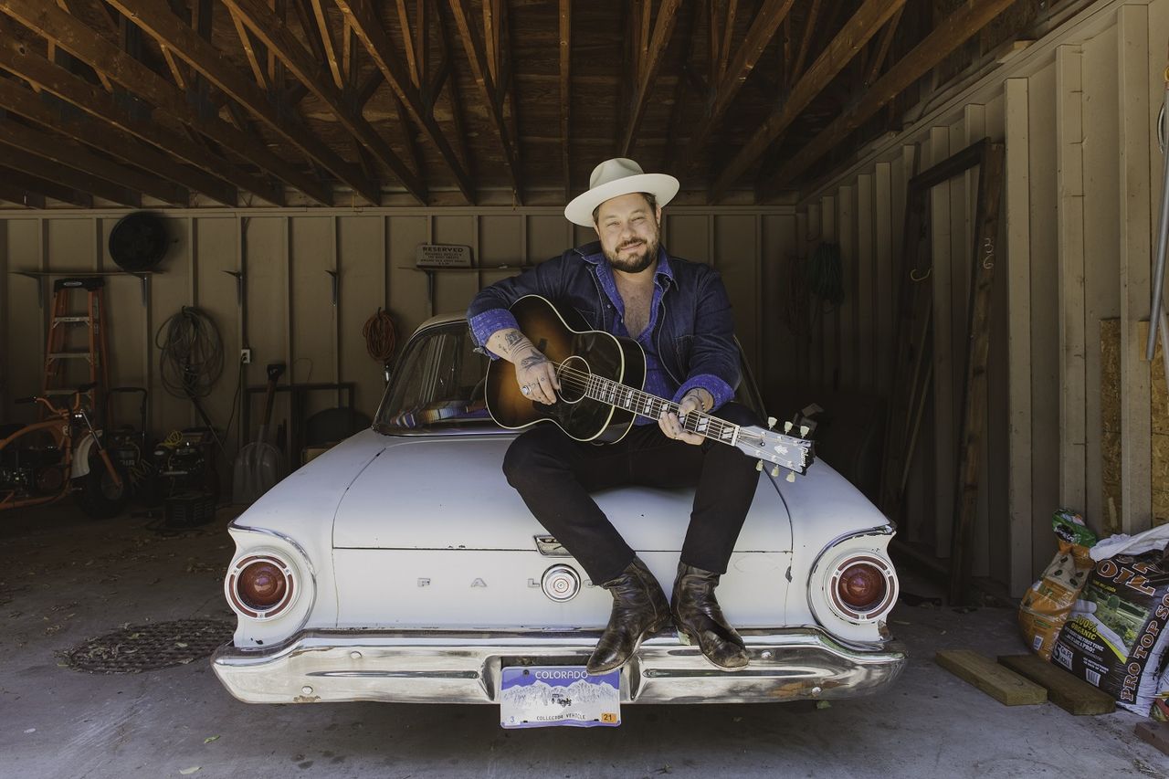 Nathaniel Rateliff with his new Gibson signature LG-2 Western acoustic guitar