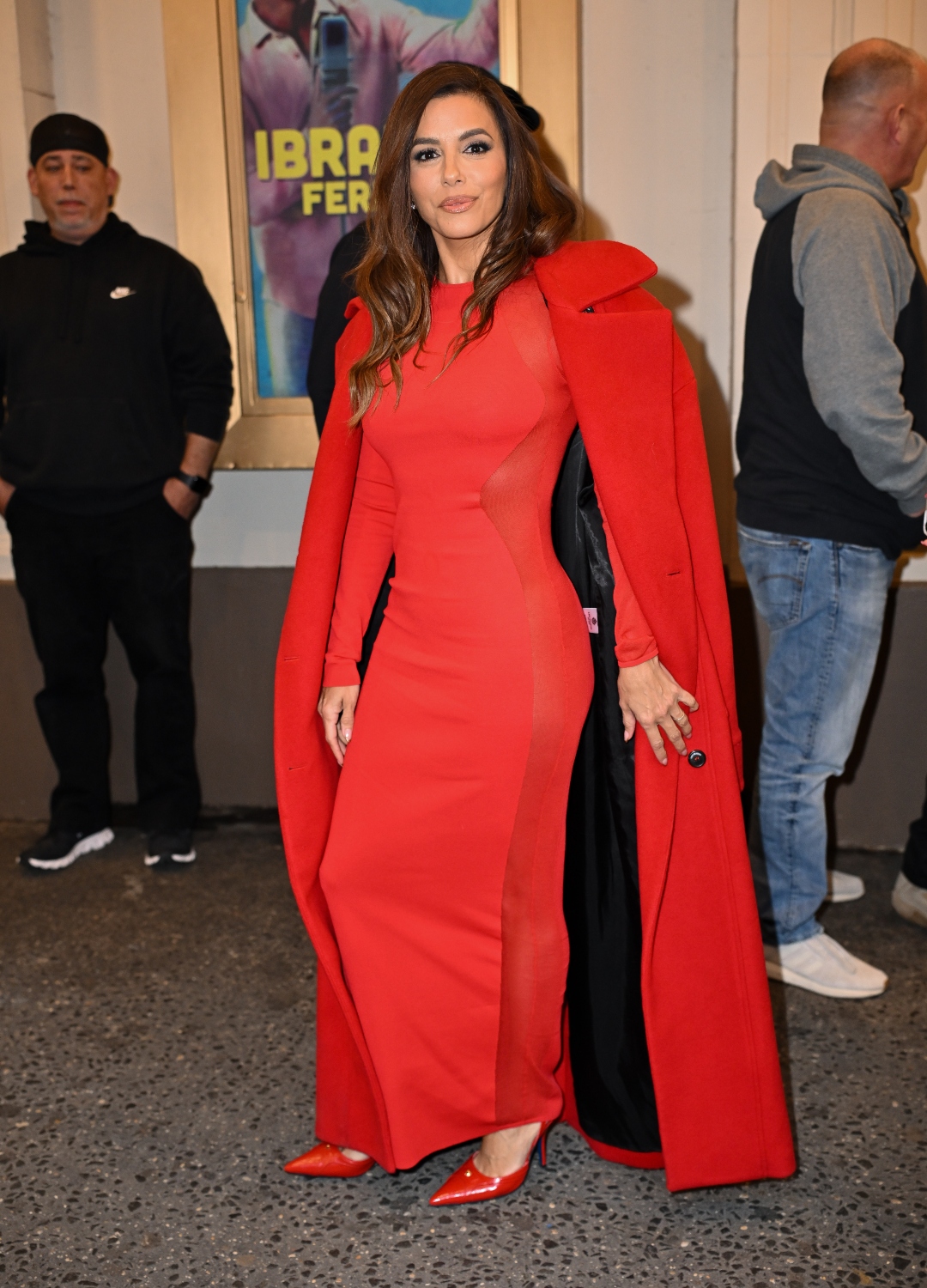 Eva Longoria wearing red coat
