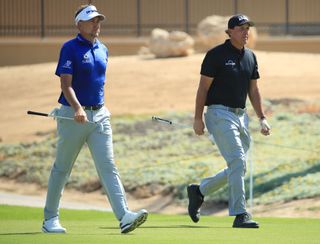 Poulter and Mickelson walk