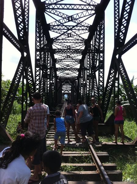 Locals come out to watch La Ruta racers past and they have a trolley to help those afraid of heights cross the bridge