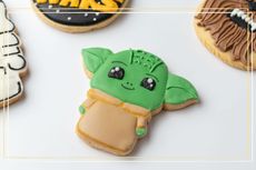 A biscuit decorated to look like Yoda