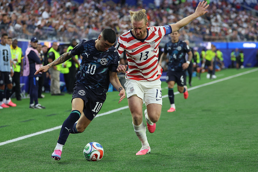 Tim Ream and Miguel Almiron fight for the ball during USA vs Paraguay at the World Cup 2026.