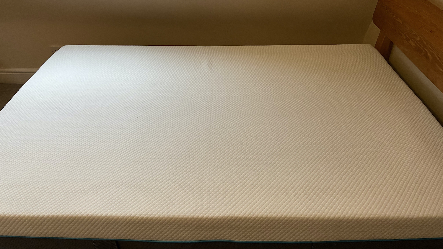 The Simba Hybrid Mattress photographed from the side in our reviewer's bedroom
