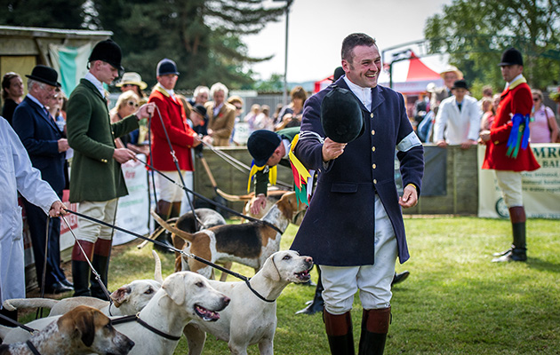 Will Hudson, huntsman of the Hampshire Hunt, shows his gratitude to the judges after claiming the local championship