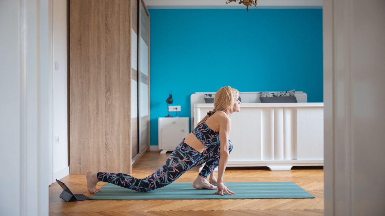 Woman holding a low lunge stretch