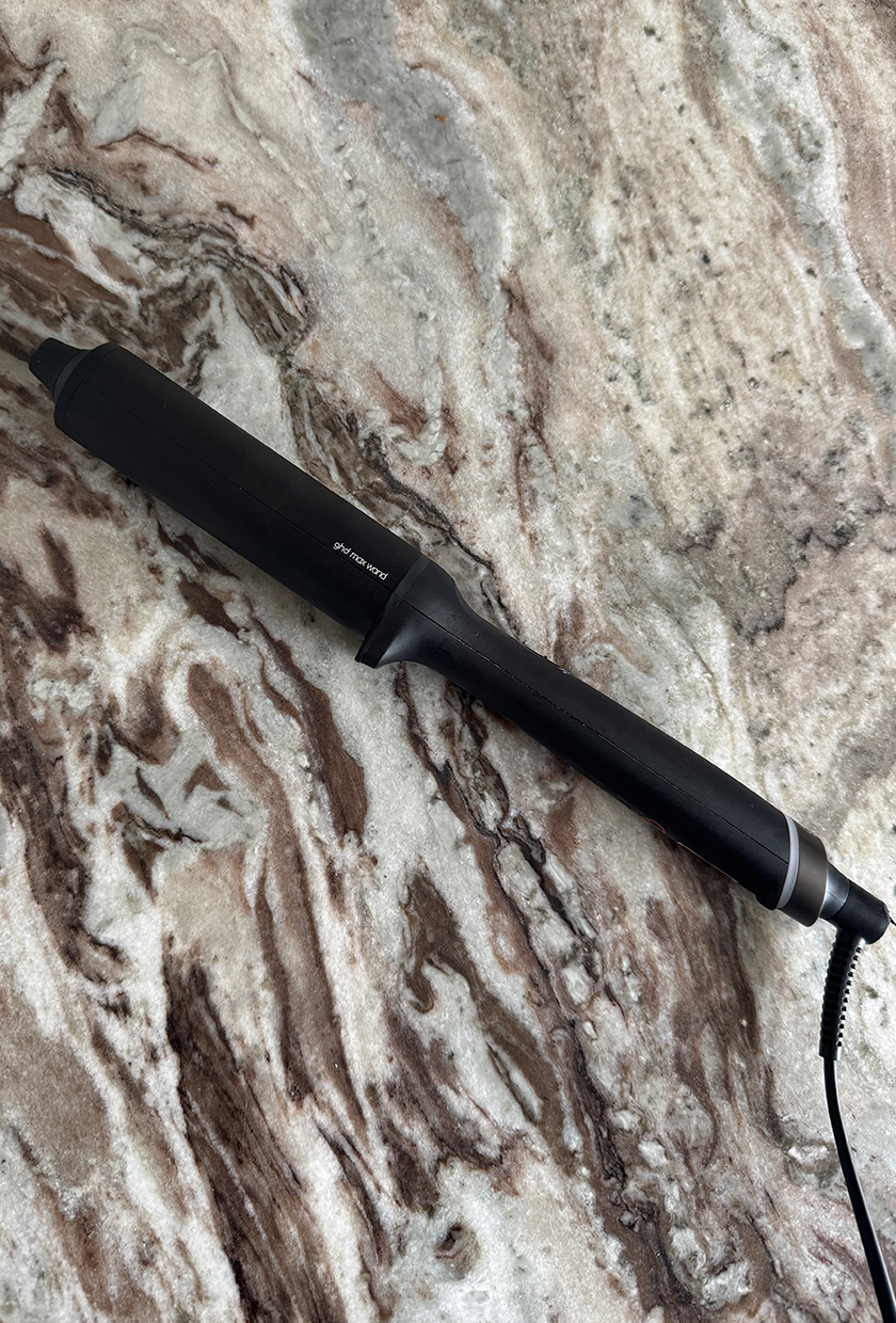 GHD Chronos Curve Max curling wand on marble table