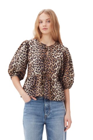 Bluse aus Popeline-Baumwolle mit Leopardenmuster und Schößchen zum Binden