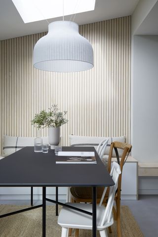 A dining room with an overhead white light